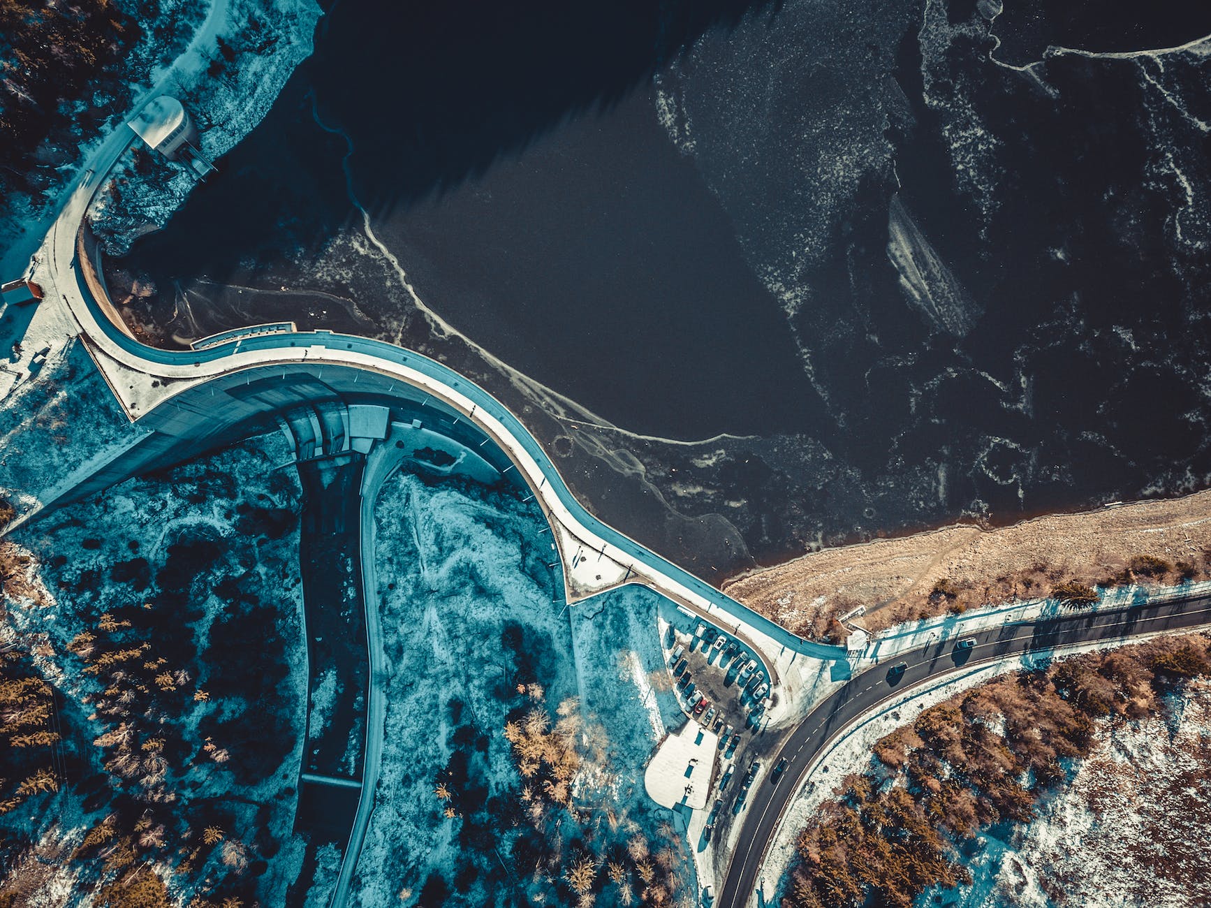 top view photography of road near the body of water